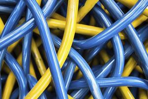 Tangled Blue and Yellow Cables Abstract Background for Technology Concepts photo