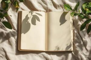 Open Notebook with Blank Pages and Plant Shadows for Journal photo