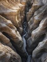 Aerial View of River Winding Through a Deep Canyon Landscape photo
