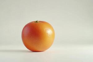 Close-up of Ripe Grapefruit on Table with Subtle Shadows photo