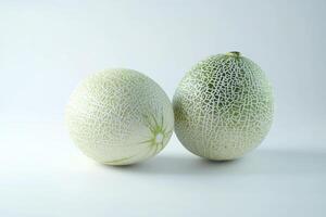 Two Fresh Honeydew Melons Displayed on a Clean White Background photo
