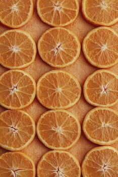 Arrangement of Sliced Oranges Creating a Vibrant and Refreshing Background photo