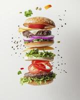 Exploded View of Delicious Burger with Fresh Ingredients Isolated on White photo