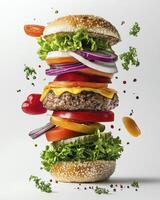 Exploding Burger with Fresh Ingredients Stacked High in Mid-air photo
