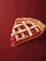 Delicious Cherry Pie Slice with Lattice Crust on Red Background photo