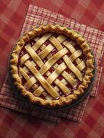 Delicious Cherry Pie with Lattice Crust on Red Checkered Tablecloth photo