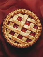 Delicious Homemade Strawberry Pie with Lattice Crust on Red Background photo