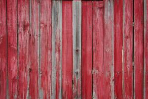 Red Painted Wooden Fence with Weathered Texture for Rustic Background photo