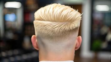 A man with a blonde mohawk haircut in a barber shop photo