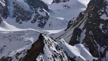 Snowy ridges and sharp peaks in the Caucasus mountains video