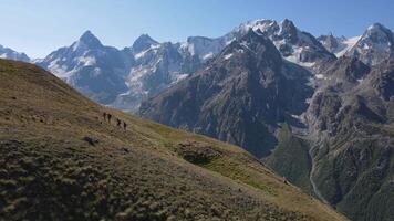 Hikers making their way along a remote mountain path video
