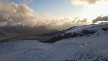 Glacial crevasses on Mount Elbrus under dramatic evening sky video