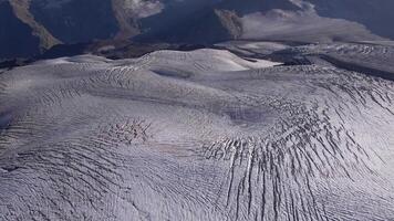 Close-up of glacial ice formations on Elbrus with deep crevasses video