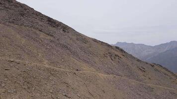 Hikers on a scenic mountain ridge with glacier views video