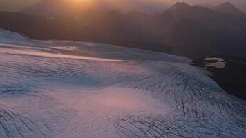 Glacier illuminated by the setting sun on Elbrus mountain video
