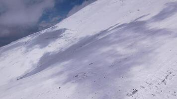 Snowy ascent on Elbrus with climbers moving towards the summit video