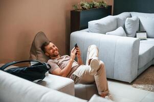 Sitting and enjoying. Customer, visiting the sofa and bed store. Looking for update photo