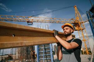 Man in uniform is working on the construction site photo