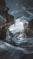 An ice cave with snow and ice on the ground photo