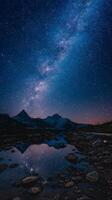 The milky way over the mountains and water photo