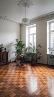 An empty room with a wooden floor and a window photo