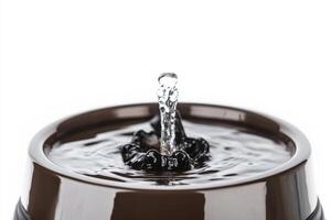 High-quality pet water fountain with flowing water on a clean white background photo