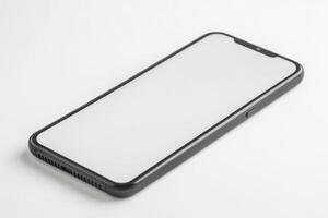 An iphone with a blank screen on a white surface photo