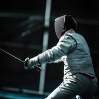 Mastery of movement in fencing at a competitive training session in an indoor arena photo