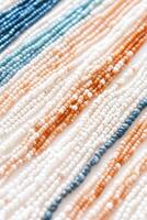 Intricate bead art design showcasing colorful threads and beads intertwined in an elegant arrangement photo