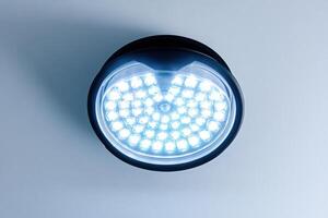 A close up of a light on a wall photo