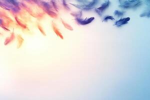Feathers flying in the air with a blue sky background photo