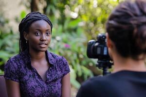 Engaging outdoor conversation between a journalist and a subject in a lush garden setting photo