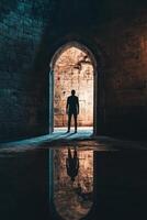 Exploring the haunting entrance of an ancient crypt with feelings of anxiety and curiosity photo