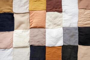 Vivid patchwork of diverse textile samples forms a colorful backdrop for creativity and inspiration photo