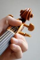Detail-oriented musical instrument tuner working meticulously in a professional music studio environment photo