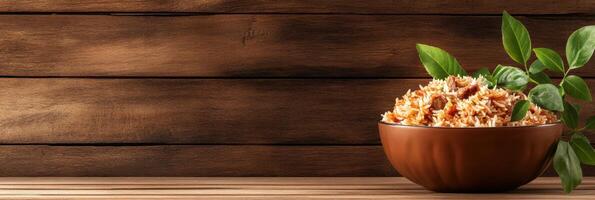 Savoring fragrant biryani presented beautifully in a bowl on a rustic wooden table photo