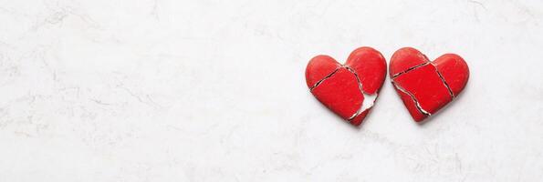 Struggles with intimacy represented through minimalistic hearts separated by barriers conveying emotional disconnect and connection challenges photo