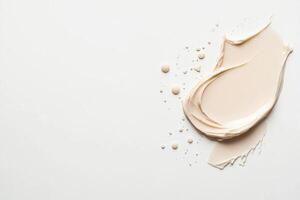 BB cream drop and smear on a clean white background creates a smooth and elegant beauty display photo