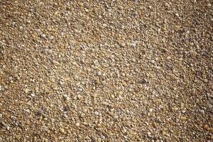 High quality studio background of a pebbled beach with natural lighting and soft focus for creative projects photo