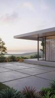 A modern house with a large patio and a view of the ocean photo