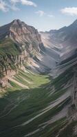 A mountain valley with green grass and mountains photo