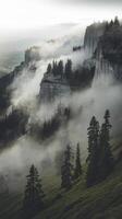 A mountain with fog and trees on top photo