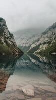 A mountain lake surrounded by rocks and trees photo