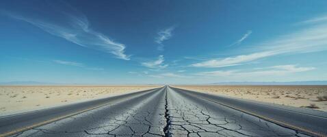 An empty road in the desert with a sky and clouds photo