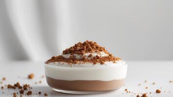 Chocolate pudding in a glass with whipped cream and cocoa powder on a white background photo