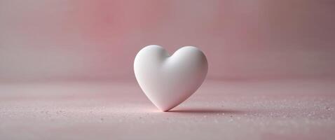 A white heart shaped object on a pink background photo