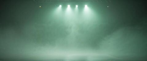 A green light shines on a stage with fog photo