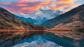 A mountain range is reflected in a lake photo
