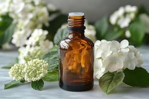 Essential Oils Concept with Amber Glass Bottle and Fresh White Flowers for Aromatherapy photo