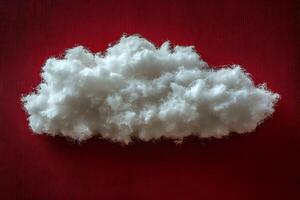 Creative Conceptual Fluffy Cloud on Vibrant Red Background for Abstract Design photo